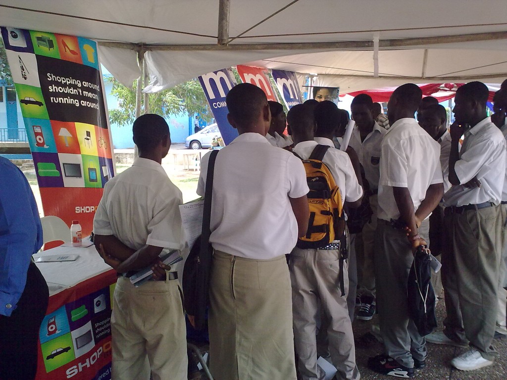 A lady explains the Etranzact platform to a group of students @ the e-village. An Etranzact Ghana event in Accra. Photo by Oluniyi David Ajao.