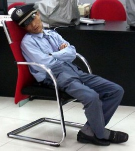 A bank security guard fast asleep. In this state, he is offering no security. A cracked security suite software is even worse.