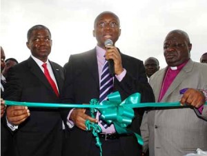 The Official Commissioning of Chams City took place at Isaac John Crescent in GRA Ikeja Lagos on 30th October 2008. This photo sourced from chams.com shows Engr Ernest Ndukwe, Vice Chairman, Nigerian Communications Commission cutting the tape to declare open the Plaza while Prof Bayo Akinde, Chairman of the Company right and Mr. Demola Aladekomo, MD/CEO of Chams Plc left looks on at the ceremony.