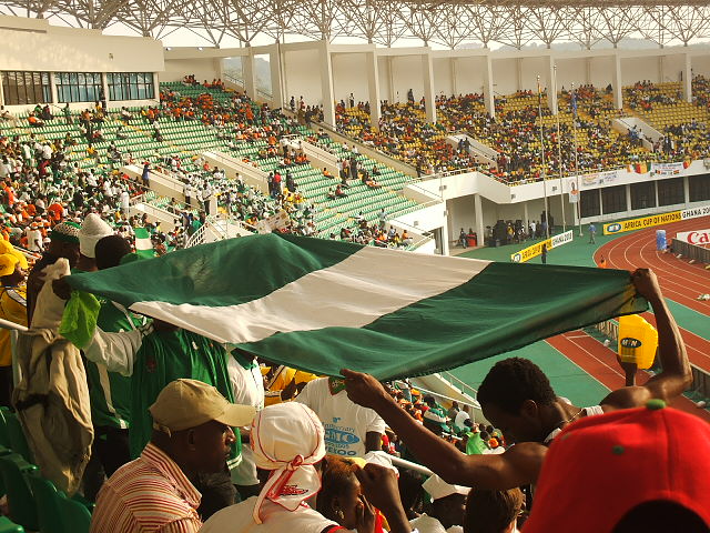 Some Nigerian fans lift their flag high just before a match between Cote d'Ivoire and Nigeria for a group stage match in Ghana 2008. Photo by Oluniyi David Ajao.