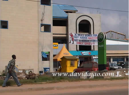 A signpost to a Glo World outlet in Accra