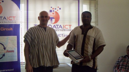 Mr Gregory Eid (L) handing over an Apple iPad to a lucky customer, who won a prize draw recently.