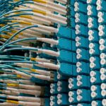 Fibre-optic patch cables connected to a network patch panel