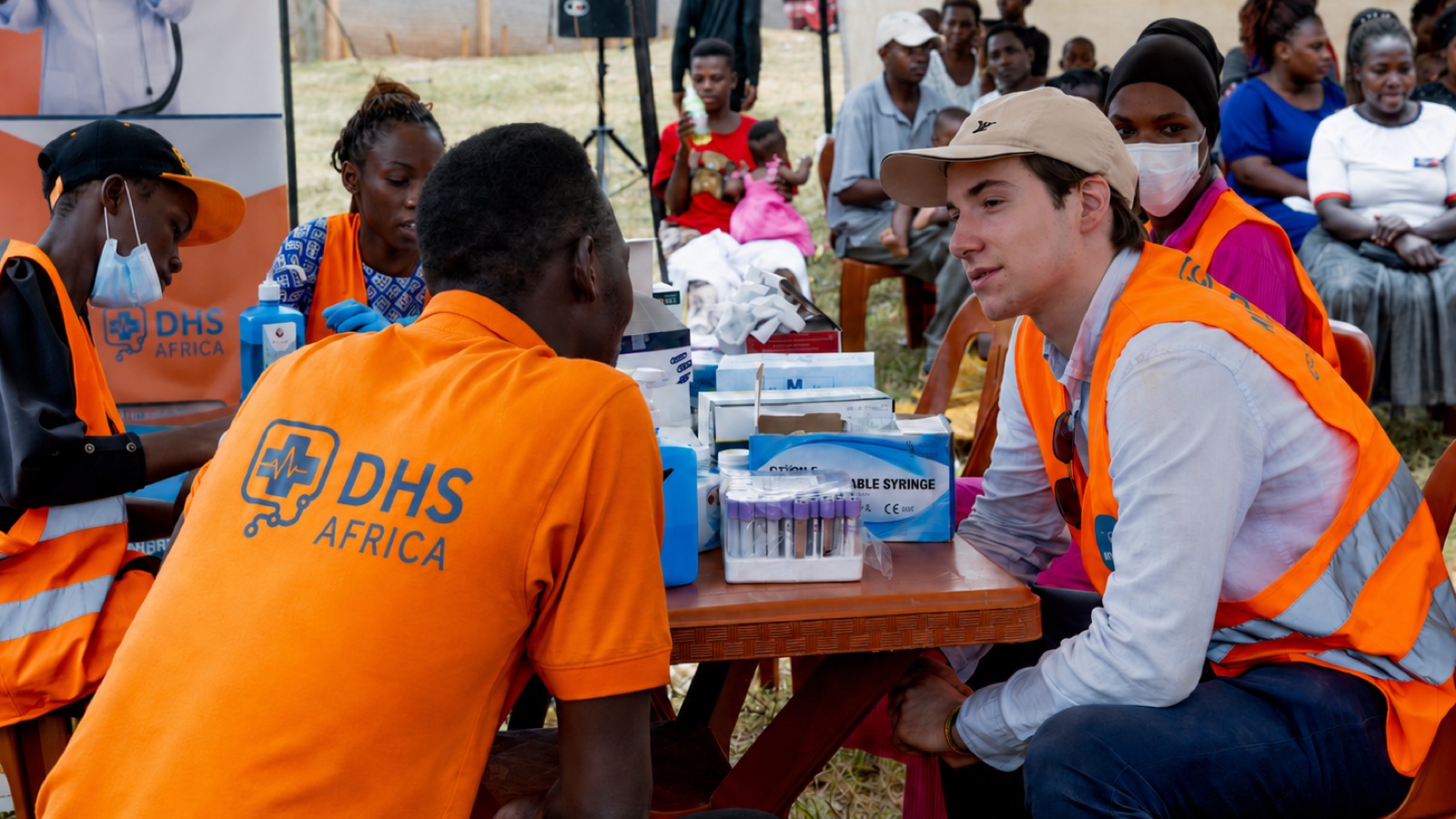 Why African digital health may be a better starting point for AI than the West's 1 DHS Africa staff in branded vests register community members at an outdoor clinic onboarding day in Uganda