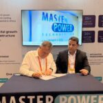 Menno Parsons of Digital Parks Africa signs the Uptime Institute Tier IV engagement for NDC1, with Tarik Bahanniss of Uptime Institute, at ITW Africa in Nairobi