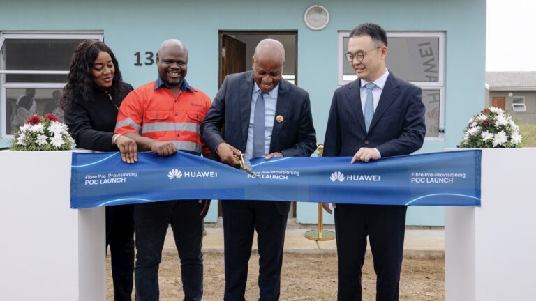 Four officials cut a ribbon reading Fibre Pre-Provisioning POC Launch in front of a new house in Empangeni, KwaZulu-Natal