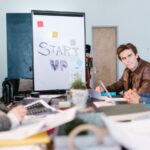 Young professionals brainstorming around a table in a startup office