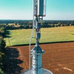 Mobile phone mast standing among farmland