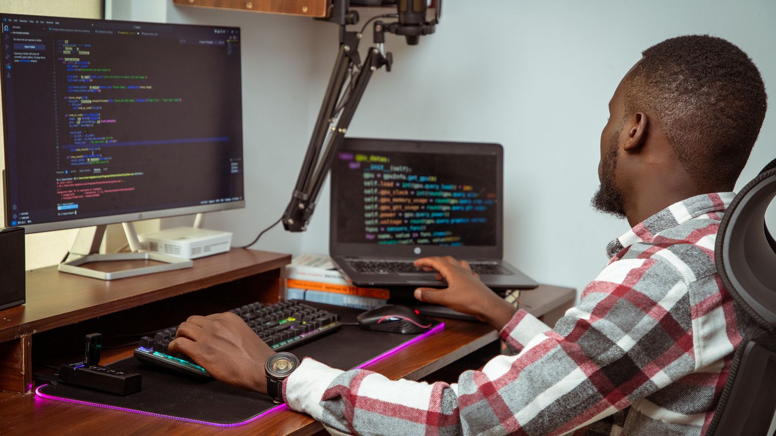 African crowd builds 4,216 AI safety tests in 8 languages 1 An African developer coding at a desktop and laptop