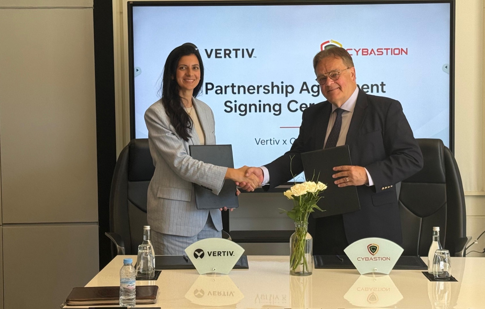 Vertiv and Cybastion team up on African data centres 1 Vertiv's Zineb Kamri shakes hands with Cybastion's Scott Blacklin after signing a data centre partnership in Marrakech, Morocco.