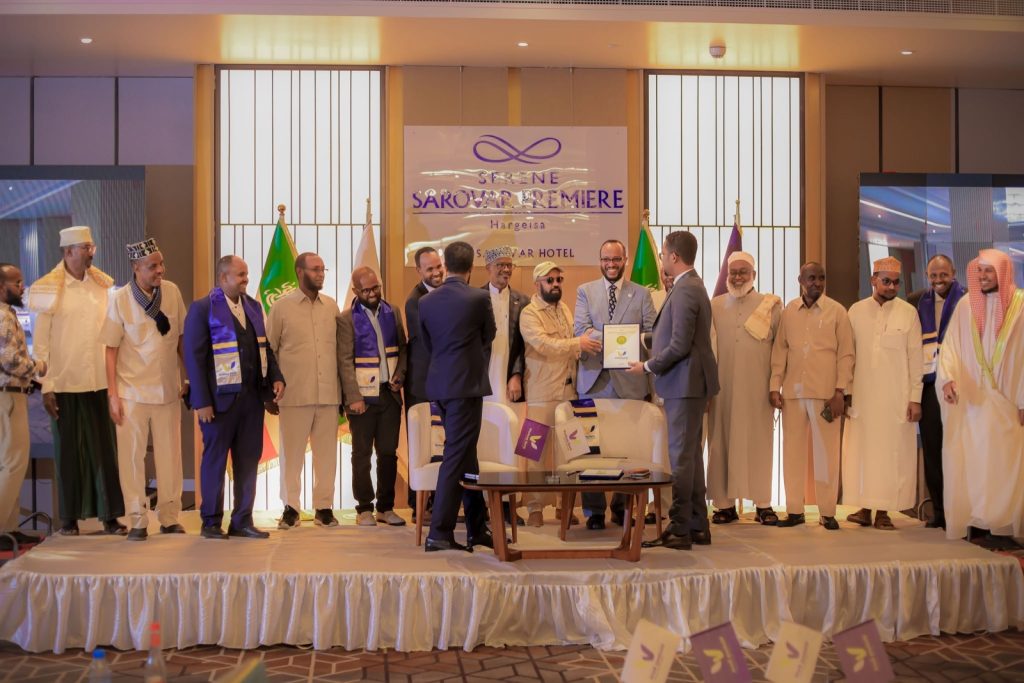 Q&A: building a digital Islamic bank in Somaliland 3 Wadaag Bank executives and guests on stage as a framed document is presented at the bank's launch in Hargeisa, Somaliland.