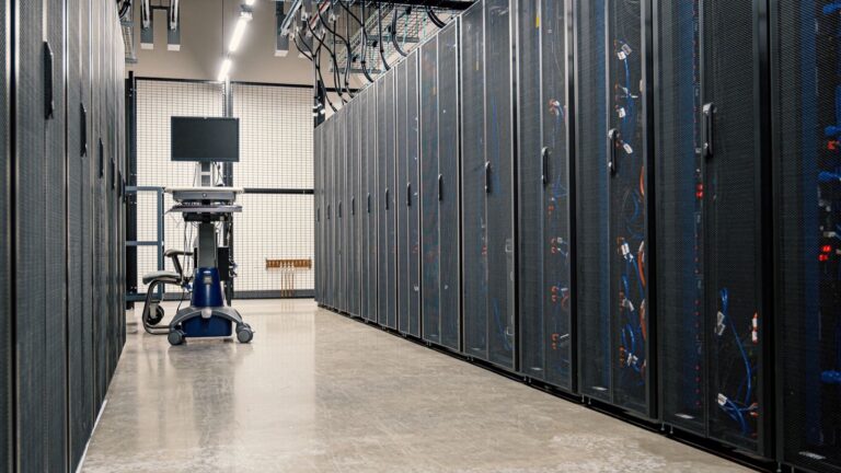 Server cabinets and networking equipment inside a data centre