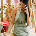 A small-business owner using a mobile phone